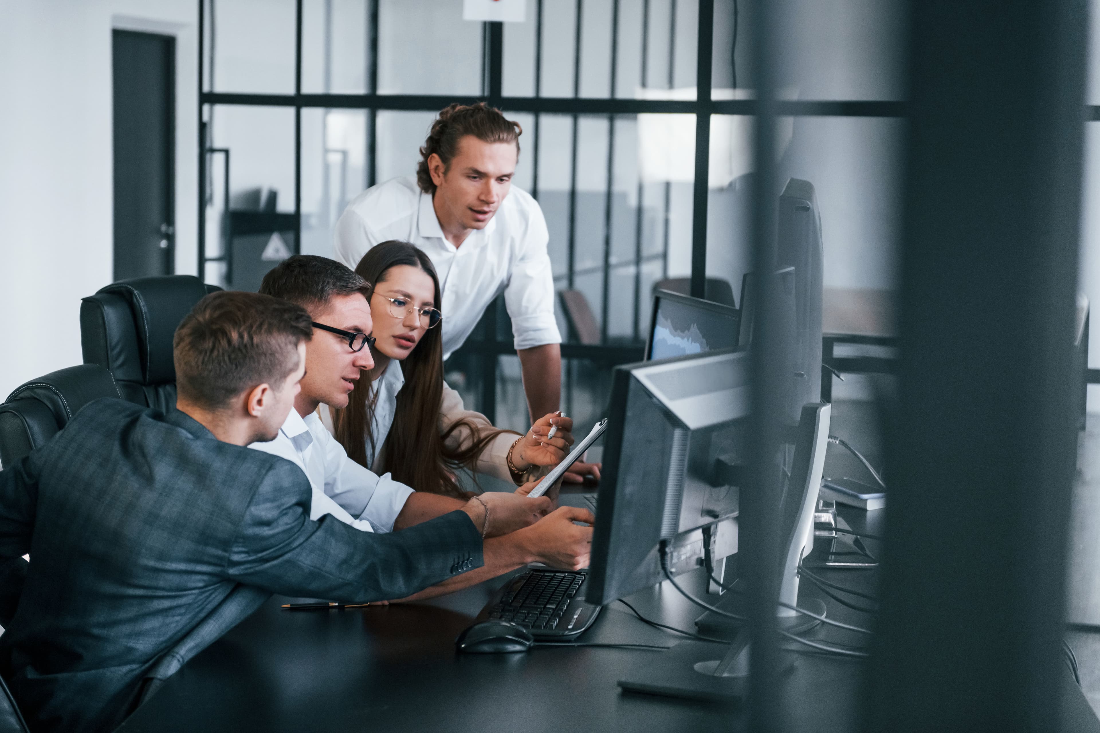 analysing-information-team-of-stockbrokers-works-2025-03-18-20-17-52-utc.jpg