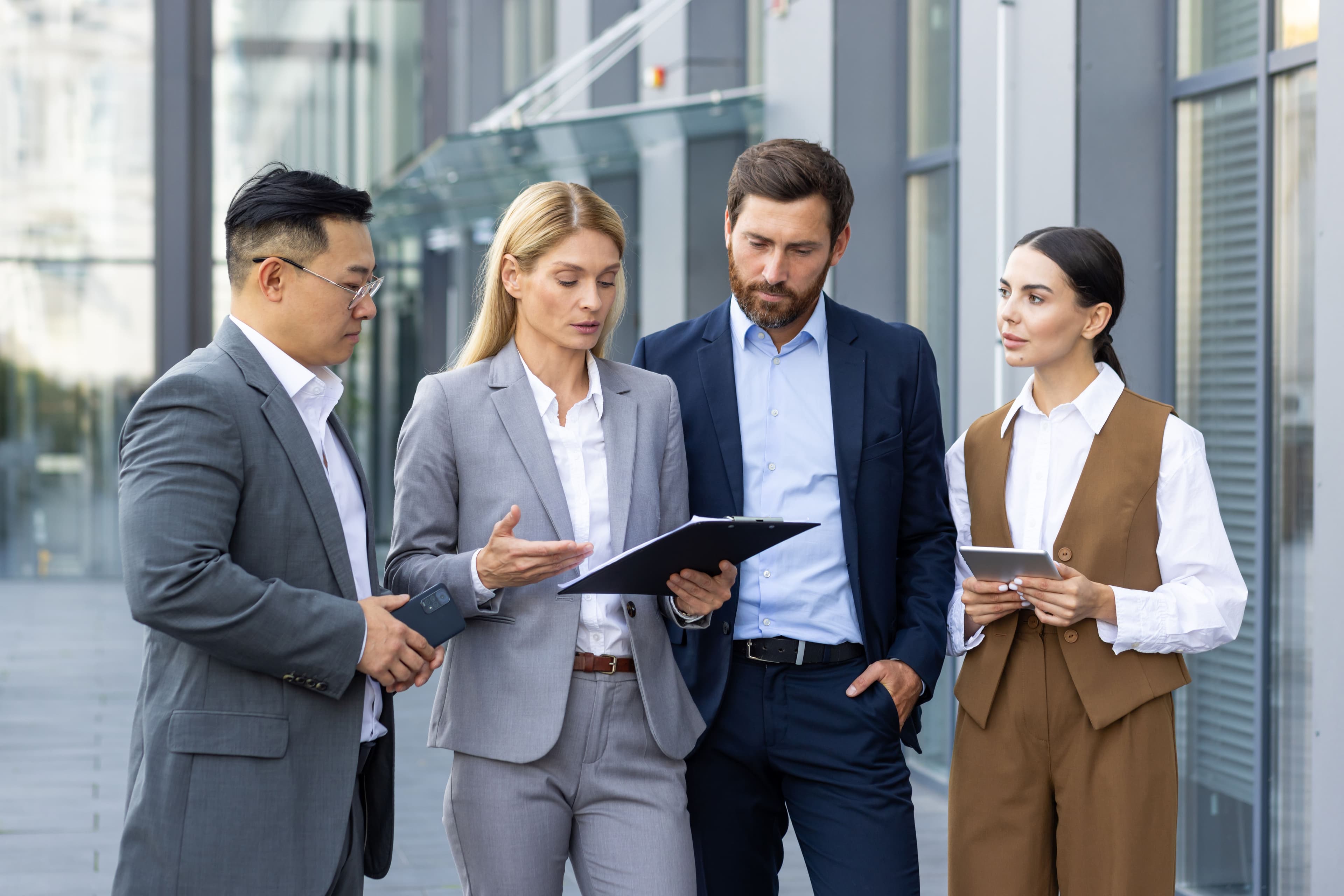 four-business-people-discussing-financial-results-2025-03-31-21-14-59-utc.jpg