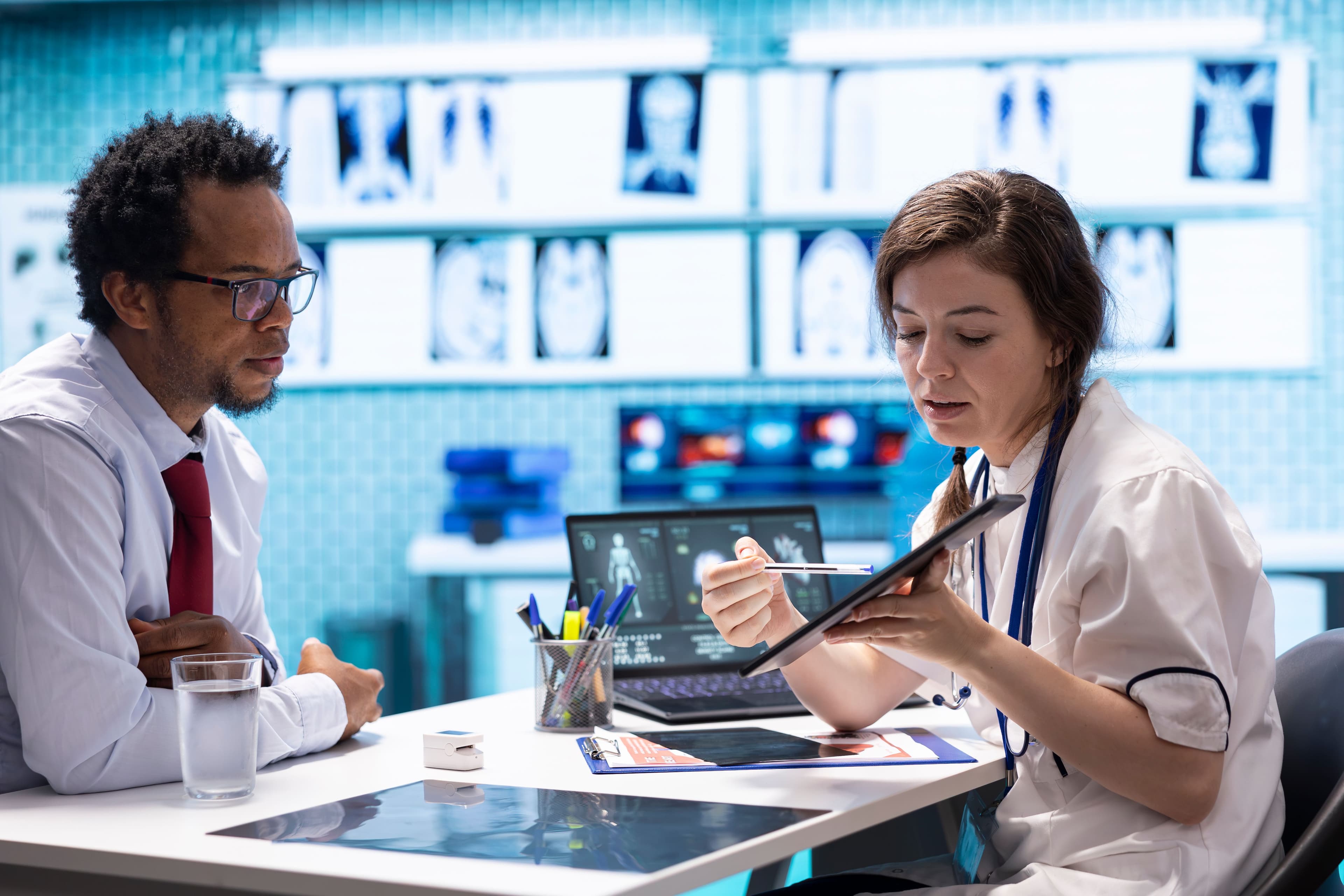medical-staff-reviewing-diagnostic-reports-and-res-2025-02-20-03-25-43-utc.jpg