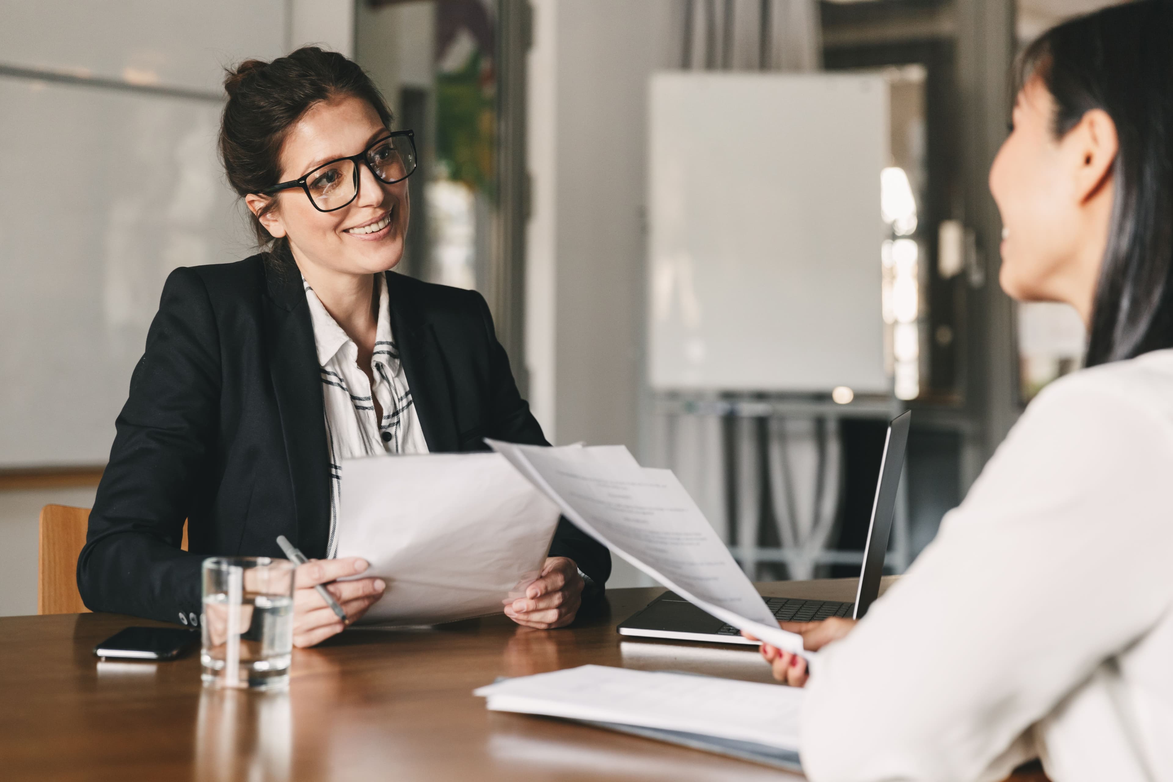 portrait-of-smiling-businesswoman-holding-resume-a-2025-02-14-07-52-57-utc.jpg